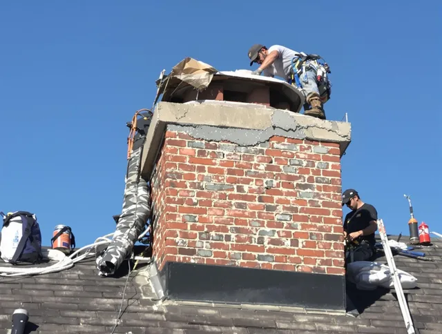 Wesley Chapel Chimney Sweep installing a custom chimney crown in Wesley Chapel, FL