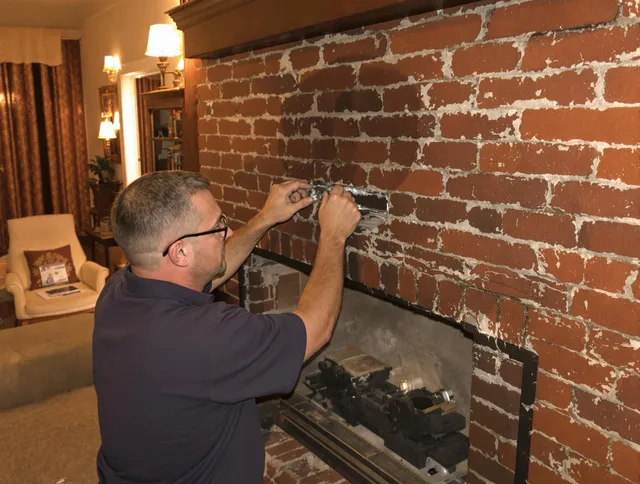 Wesley Chapel Chimney Sweep expert fixing a fireplace in Wesley Chapel, FL